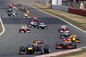 United Kingdom Collection: Formula One World Championship: Mark Webber Red Bull Racing RB6 leads at the start of the race