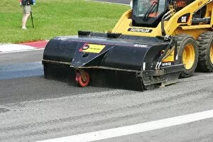 Images Dated 8th June 2008: Formula One World Championship: Marshals clean the track surface at turn one