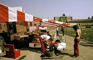 Images Dated 3rd April 2003: Formula One World Championship: McLaren mechanics work on the M23 of Emerson Fittipaldi in