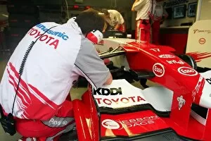 Images Dated 8th October 2005: Formula One World Championship: Mechanic works on the Toyota TF105 of Ralf Schumacher