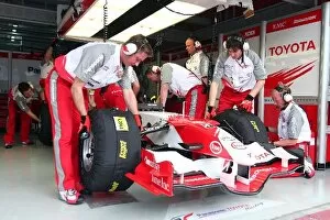 Formula One World Championship: Mechanics work on the car of Ralf Schumacher Toyota