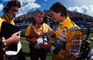 Engineer Collection: Formula One World Championship: Michael Schumacher talks with his race engineers
