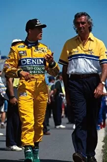 Canada Collection: Formula One World Championship: Michael Schumacher, left, talks with Benetton Boss Flavio Briatore