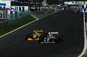 Portugal Gallery: Formula One World Championship: Michael Schumacher Benetton B193A attempts to overtake Alain Prost