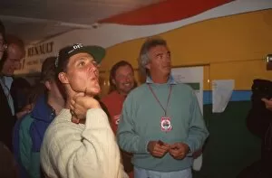 Europe Collection: Formula One World Championship: Michael Schumacher and Flavio Briatore relax with a game of darts