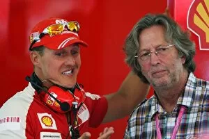 Images Dated 22nd August 2009: Formula One World Championship: Michael Schumacher Ferrari with Eric Clapton Rock Legend