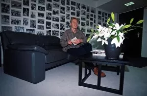 Images Dated 1st August 2001: Formula One World Championship: Mika Hakkinen with pictures of his achievements on his wall