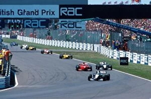 Britain Gallery: Formula One World Championship: Mika Hakkinen leads on lap 2 after the re-start