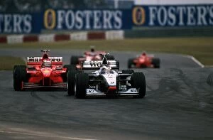 Formula One World Championship: Mika Hakkinen McLaren Mercedes MP4 / 13 leads Michael Schumacher Ferrari F300