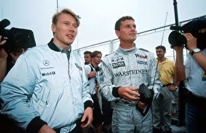 Sao Paulo Gallery: Formula One World Championship: Mika Hakkinen McLaren and David Coulthard McLaren play with radio