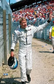 Formula One World Championship: Mika Hakkinen Mclaren retires after a tyre blow out