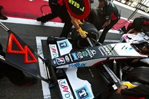 Images Dated 4th July 2004: Formula One World Championship: Minardi practice pitstops with a new front jack that has flashing