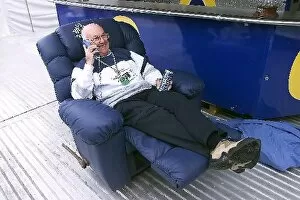 Images Dated 30th August 2001: Formula One World Championship: Murray Walker ITV Sport Presenter puts his feet up as he comes
