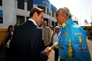 Images Dated 16th July 2009: Formula One World Championship: Nicholas Clarry CVC Capital Partners talks with Flavio Briatore
