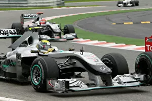 Best Images Collection: Formula One World Championship: Nico Rosberg Mercedes GP MGP W01 runs wide battling with Vitaly