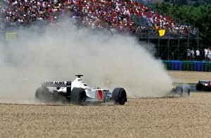 Images Dated 22nd July 2002: Formula One World Championship: Olivier Panis BAR Honda 004 takes to the gravel at the first corner