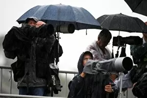 Images Dated 17th October 2009: Formula One World Championship: Photographers brave the rain