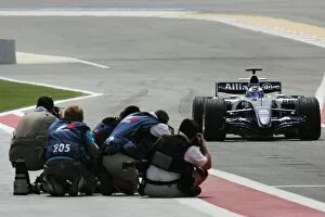 Images Dated 11th March 2006: Formula One World Championship: Photographers get close to the action