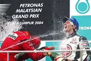 2004 Collection: Formula One World Championship: third placed Jenson Button BAR with race winner Michael Schumacher