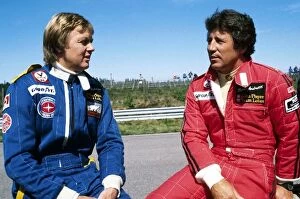 Team Mates Collection: Formula One World Championship: Third placed Ronnie Peterson talks with his Lotus team mate Mario