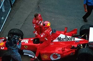 Team Mates Gallery: Formula One World Championship: Third placed Rubens Barrichello congratulates his team mate