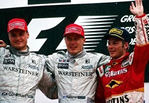 Images Dated 3rd September 2004: Formula One World Championship: The podium: David Coulthard McLaren, second; Mika Hakkinen McLaren