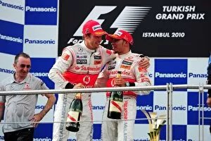 Formula One World Championship: The podium: second placed Jenson Button McLaren with race winner Lewis Hamilton McLaren