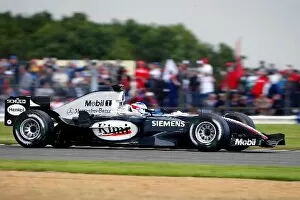 Images Dated 10th July 2004: Formula One World Championship: Pole sitter Kimi Raikkonen McLaren Mercedes MP4 / 19B