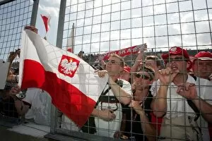 Images Dated 8th June 2008: Formula One World Championship: Polish fans celebrate victory for Robert Kubica BMW Sauber F1
