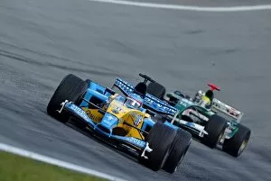 Images Dated 18th May 2003: Formula One World Championship: Race retiree Fernando Alonso Renault R23 leads Mark Webber Jaguar