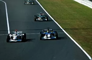 2002 Collection: Formula One World Championship: Race retiree Jacques Villeneuve BAR Honda 004 overtakes Felipe