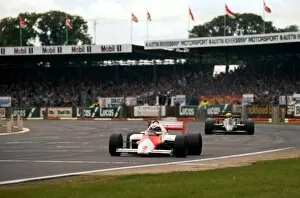 1985 Collection: Formula One World Championship: Race winner Alain Prost McLaren MP4 / 2B leads Ayrton Senna Lotus