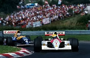 Hungary Gallery: Formula One World Championship: Race winner Ayrton Senna McLaren MP4 / 6 leads Riccardo Patrese