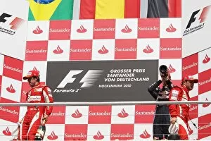 Formula One World Championship: Race winner Fernando Alonso Ferrari leaves the podium from the opposite side of second