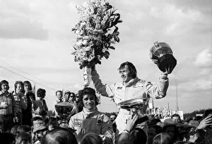 Celebrate Collection: Formula One World Championship: Race winner Jackie Stewart Tyrrell celebrates on the podium with