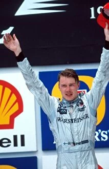 Formula One World Championship: Race winner Mika Hakkinen McLaren on the podium