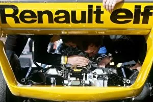 Images Dated 19th January 2006: Formula One World Championship: Renault mechanics work on the rear of the Renault RS11 of