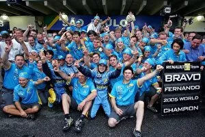 Images Dated 25th September 2005: Formula One World Championship: The Renault team celebrates Fernando Alonso becoming World Champion