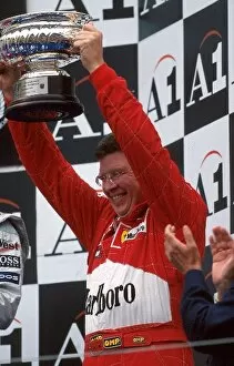 Images Dated 2nd August 2001: Formula One World Championship: Ross Brawn Ferrari Technical Director lifts the constructors trophy