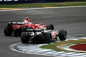 Images Dated 25th September 2005: Formula One World Championship: Rubens Barrichello Ferrari F2005 passes Jenson Button BAR Honda 007