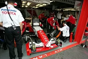 Images Dated 27th August 2004: Formula One World Championship: Ryan Briscoe Toyota TF104B in the garage