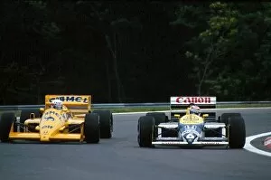 1987 Collection: Formula One World Championship: Satoru Nakajima Lotus 99T lets past Winner Nelson Piquet in practice