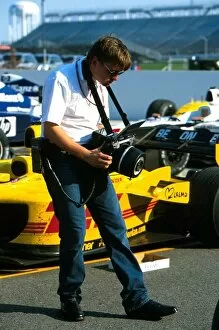2002 Collection: Formula One World Championship: Scrutineers use a special camera to measure the cars in parc ferme