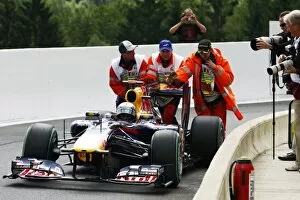 Best Images Collection: Formula One World Championship: Sebastian Vettel Red Bull Racing RB6 stops in the pit lane