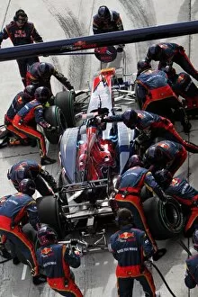 Formula One World Championship: Sebastien Buemi Scuderia Toro Rosso STR5 makes a pit stop