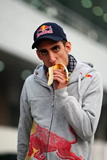 Images Dated 22nd October 2010: Formula One World Championship: Sebastien Buemi Scuderia Toro Rosso eats a banana