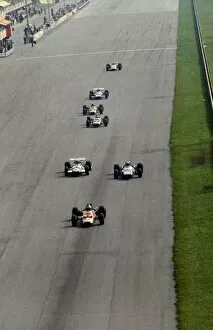 1969 Collection: Formula One World Championship: Second placed Jochen Rindt Lotus 49B leads the race from Jackie