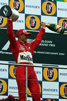 Spa Francorchamps Gallery: Formula One World Championship: Second placed Michael Schumacher Ferrari celebrates his seventh