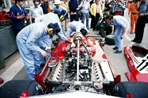 Mechanic Gallery: Formula One World Championship: Second placed Niki Lauda sits in his Ferrari 312T2 as mechanics