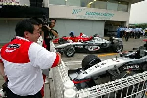 Images Dated 12th October 2003: Formula One World Championship: Shigeo Watanabe President & CEO Bridgestone Corporation looks into